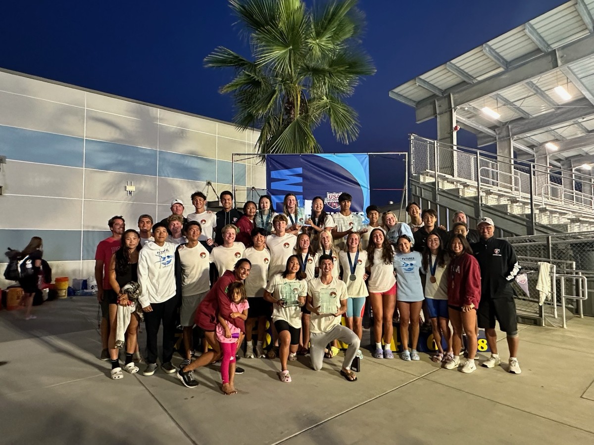 PASA swimmers and coaches celebrating together at a Futures championship meet