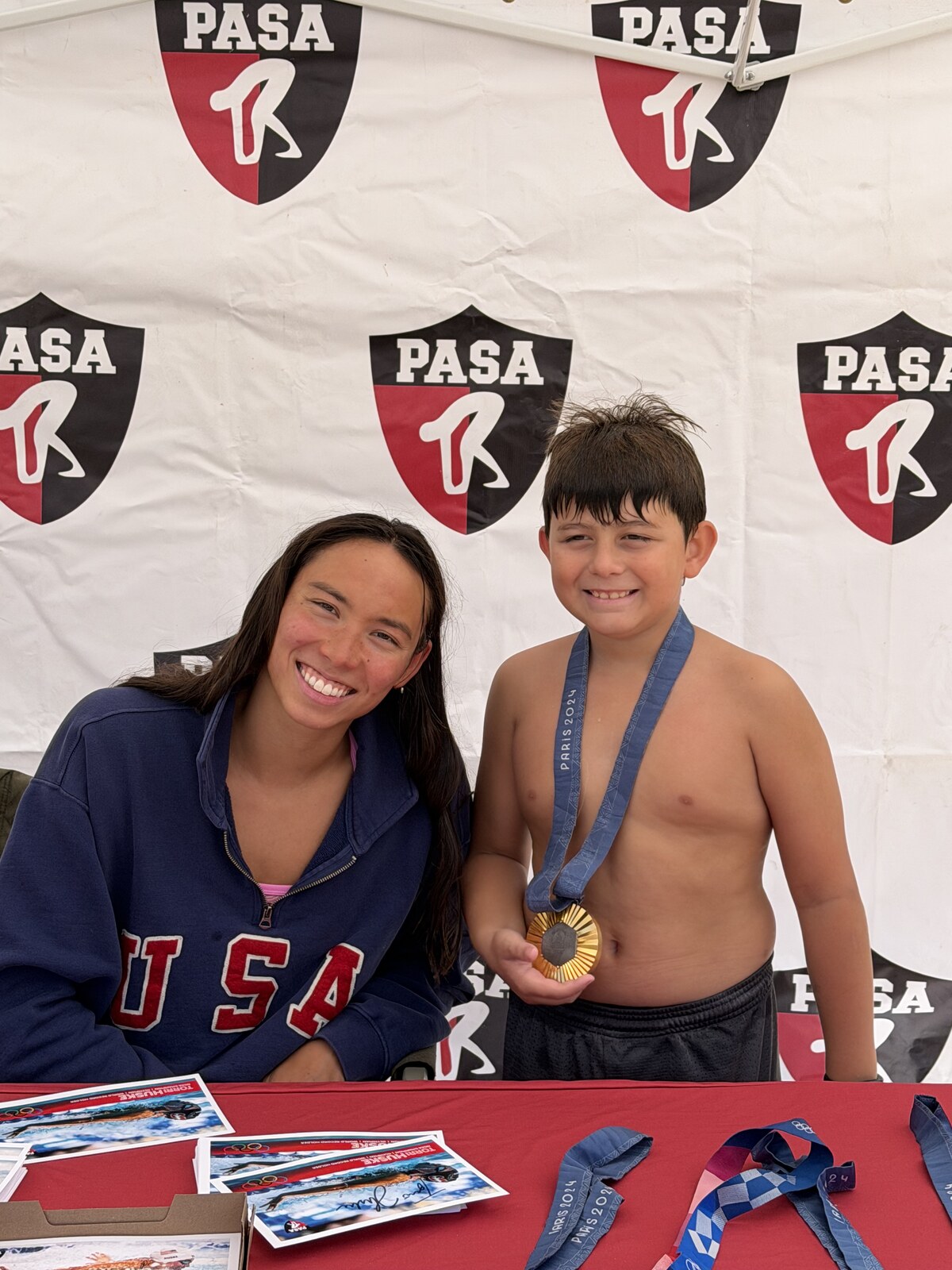 Olympic champion Torri Huske with PASA swimmers at PASA-Rinconada, signing autographs and posing with her Paris 2024 Olympic gold medal