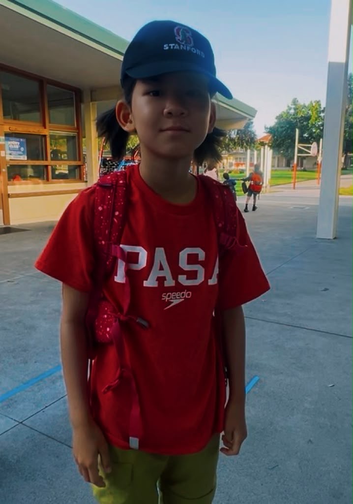 PASA swimmer in a red team shirt and Stanford cap
