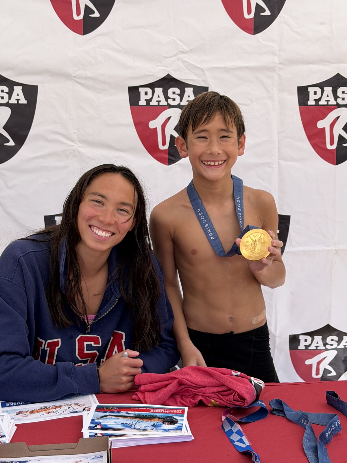 Olympic champion Torri Huske with PASA swimmers at PASA-Rinconada, signing autographs and posing with her Paris 2024 Olympic gold medal