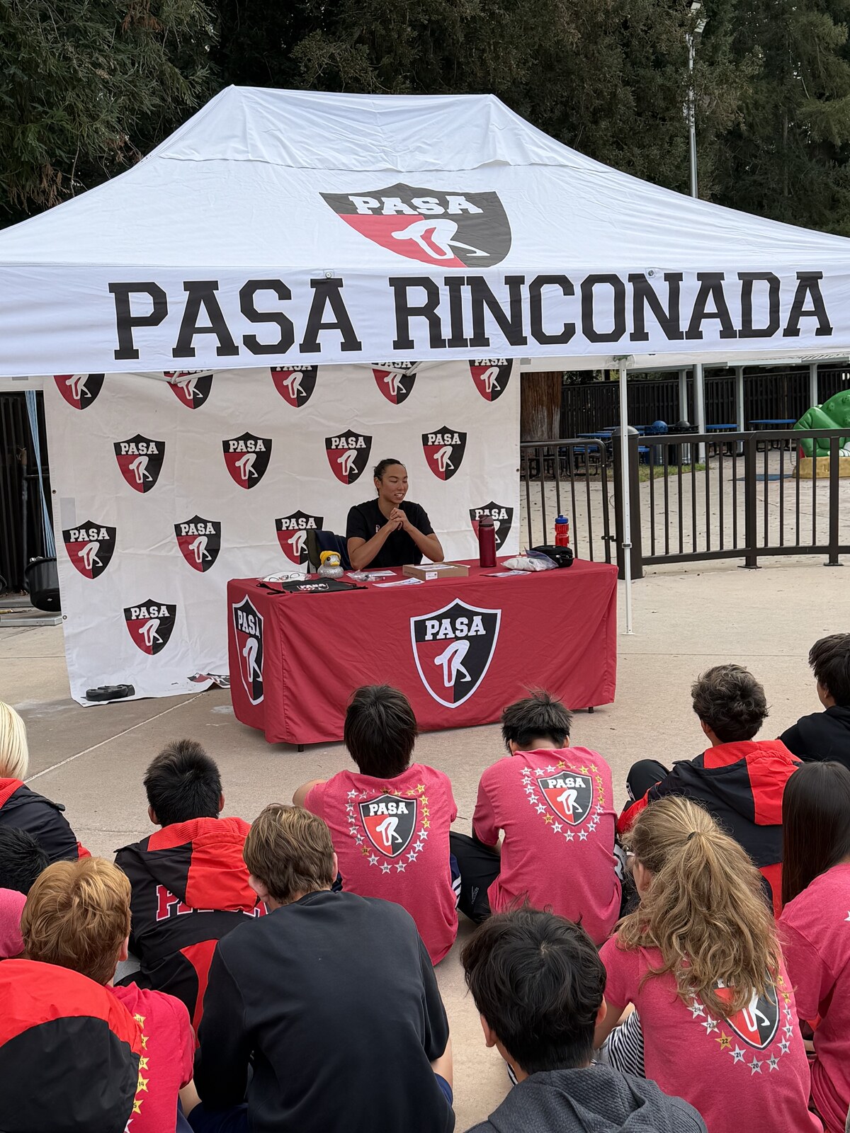 Olympic champion Torri Huske with PASA swimmers at PASA-Rinconada, signing autographs and posing with her Paris 2024 Olympic gold medal