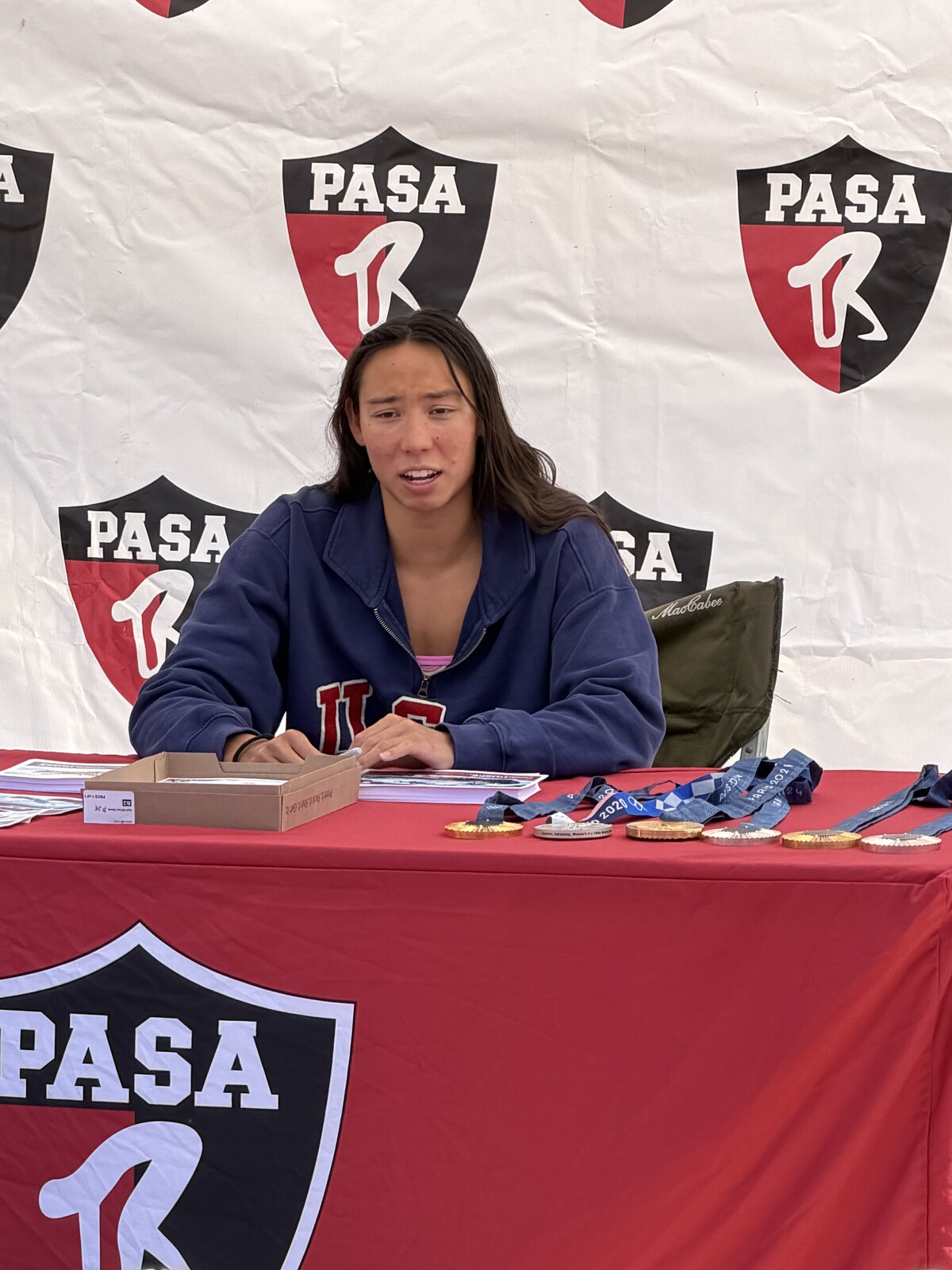 Olympic champion Torri Huske with PASA swimmers at PASA-Rinconada, signing autographs and posing with her Paris 2024 Olympic gold medal